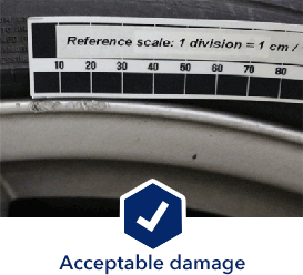 photograph of acceptable wheel damage