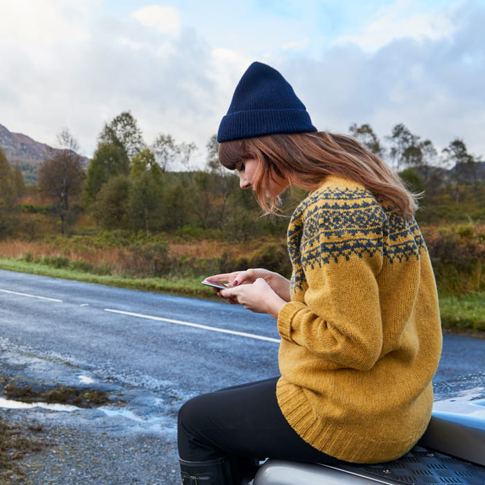 Woman by the roadside on her mobile