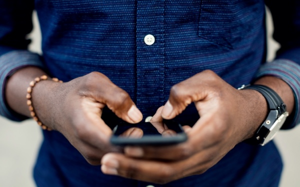 Person texting on their mobile phone