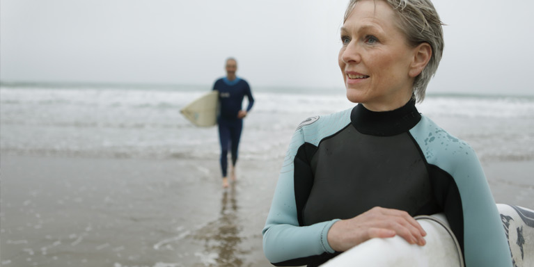 Couple surfboarding.